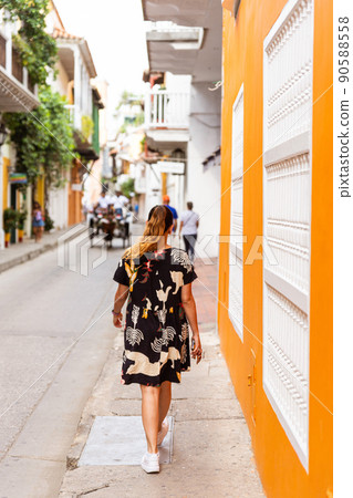 rear view of a latina woman walking in te historic center of Cartagena Colombia 90588558