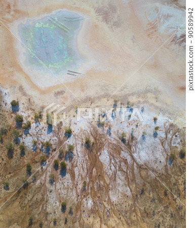 Toxic copper mine dumps surface, aerial view directly above Toxic copper mine dumps surface, aerial view directly above 90589942