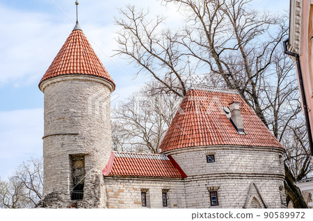 Top view of the old town - the oldest part of Tallinn in Estonia with orange tiled roofs and ancient buildings Top view of the old town - the oldest part of Tallinn in Estonia with orange tiled roofs and ancient buildings 90589972