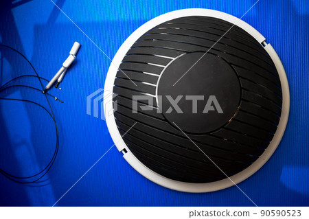 Bosu modern gym ball on blue mat top view 90590523