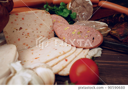 Variety of meat sausages on wooden board Variety of meat sausages on wooden board 90590680