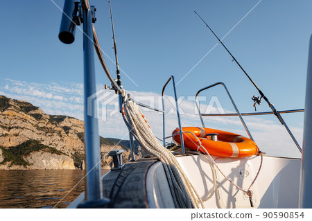 Lifebuoy saver ring on sailboat in open sea 90590854