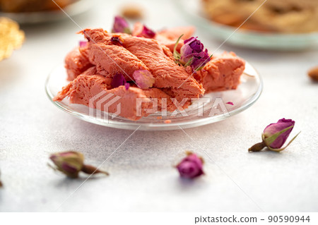 Close up of colorful Turkish halva sweets on gray surface Close up of colorful Turkish halva sweets on gray surface 90590944