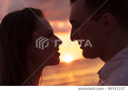 Romantic sensual young couple in love at the sunset Romantic sensual young couple in love at the sunset 90591187