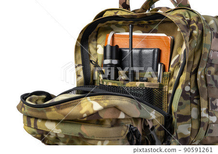 Open military backpack of khaki color on a white background Open military backpack of khaki color on a white background 90591261