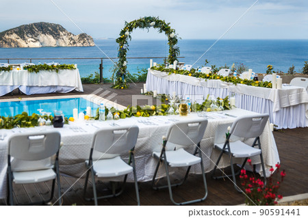 Outdoor wedding ceremony on the roof of the hotel by the sea Outdoor wedding ceremony on the roof of the hotel by the sea 90591441