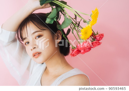 A young woman with flowers 90593465