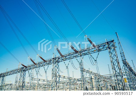 Substation skeleton, high-voltage lines and blue sky c-3 Warm and cool colors emphasized 90593517