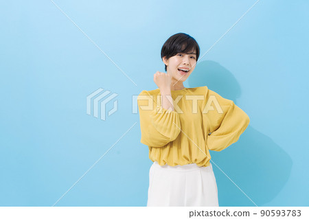 Female portrait in her 20s, light blue background 90593783