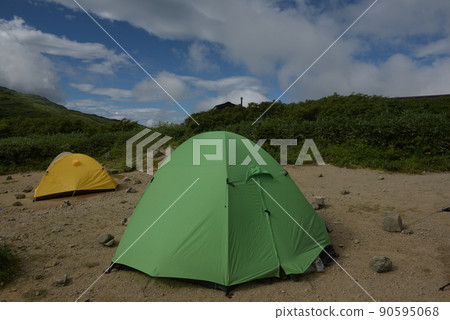 A view of the tent area of the Kirai hut on Mt. Iide in the summer of 100 famous mountains in Japan in Kitakata City, Fukushima Prefecture. A view of the tent area of the Kirai hut on Mt. Iide in the summer of 100 famous mountains in Japan in Kitakata City, Fukushima Prefecture. 90595068