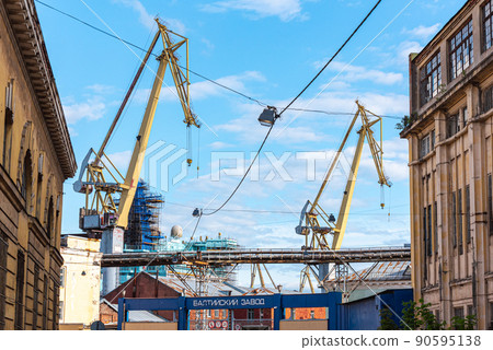 Cranes in Baltic Shipyard (which is written on the gate in Russian) in Saint Petersburg, Russia. Cranes in Baltic Shipyard (which is written on the gate in Russian) in Saint Petersburg, Russia. 90595138