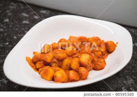 Delicious gnocchi made from potatoes in the Italian style are prepared Delicious gnocchi made from potatoes in the Italian style are prepared 90595380