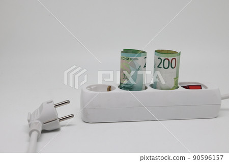 White electric cable and banknotes, expensive electricity, saving electricity. White electric cable and banknotes, expensive electricity, saving electricity. 90596157