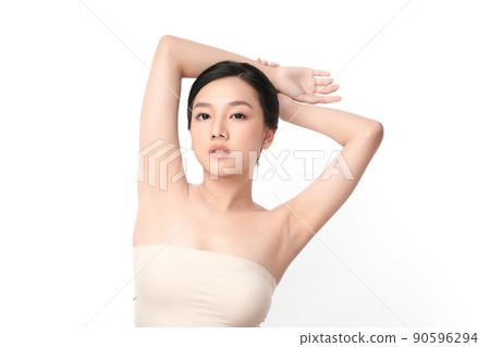 Beautiful Young Asian woman lifting hands up to show off clean and hygienic armpits or underarms on white background, Smooth armpit cleanliness and protection concept 90596294