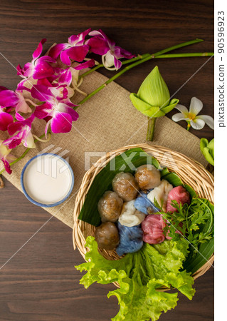 Thai dessert concept, Thai coconut milk custard and tapioca balls with pork filling on basket Thai dessert concept, Thai coconut milk custard and tapioca balls with pork filling on basket 90596923