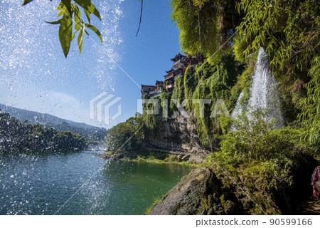 The Wangcun Waterfall at Furong Ancient Town. Amazing beautiful landscape scene of Furong Ancient Town (Furong Zhen, Hibiscus Town), China The Wangcun Waterfall at Furong Ancient Town. Amazing beautiful landscape scene of Furong Ancient Town (Furong Zhen, Hibiscus Town), China 90599166