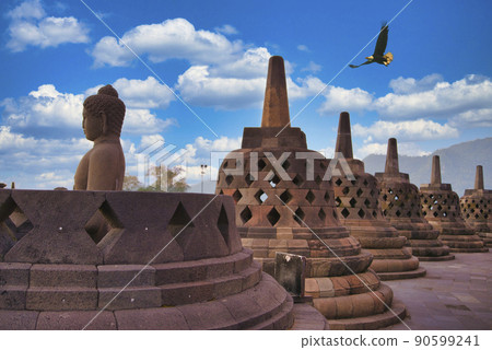 An eagle floating over the Borobudur ruins 90599241