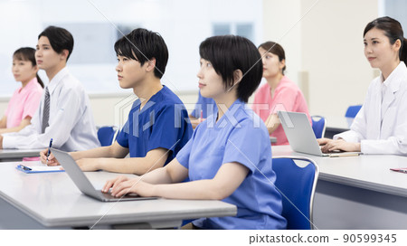 Healthcare professionals taking seminars in the conference room 90599345