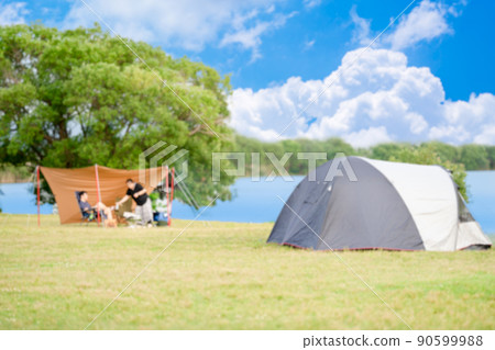 Blurred image of waterside camp 90599988