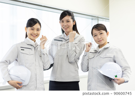 Woman in work clothes taking a seminar Woman in work clothes taking a seminar 90600745