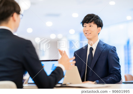Young man consulting Young man consulting 90601995
