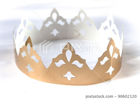 Gold paper king crown isolated on white 90602120