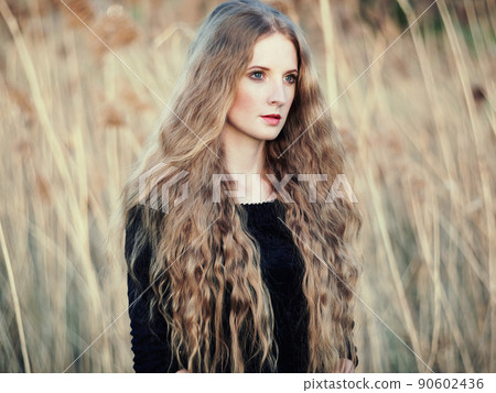 Beautiful woman on summer field. Photo on sunny day Beautiful woman on summer field. Photo on sunny day 90602436
