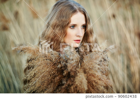 Beautiful woman on summer field. Photo on sunny day Beautiful woman on summer field. Photo on sunny day 90602438