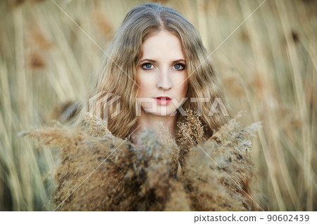 Beautiful woman on summer field. Photo on sunny day Beautiful woman on summer field. Photo on sunny day 90602439
