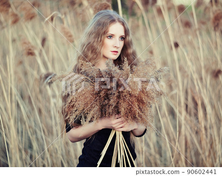 Beautiful woman on summer field. Photo on sunny day Beautiful woman on summer field. Photo on sunny day 90602441