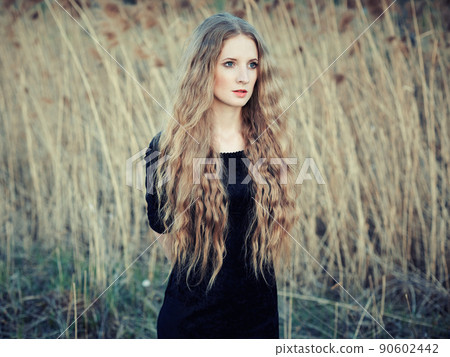 Beautiful woman on summer field. Photo on sunny day Beautiful woman on summer field. Photo on sunny day 90602442