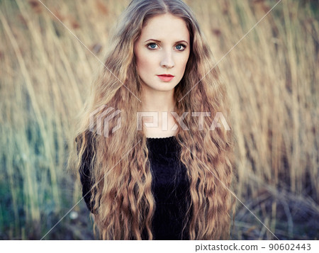 Beautiful woman on summer field. Photo on sunny day Beautiful woman on summer field. Photo on sunny day 90602443