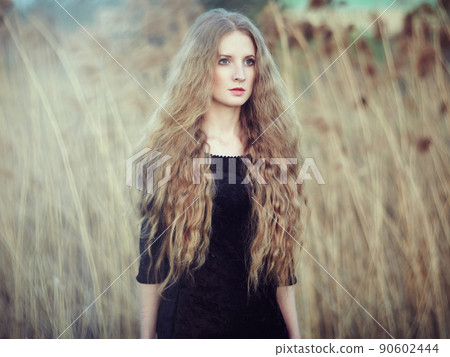 Beautiful woman on summer field. Photo on sunny day Beautiful woman on summer field. Photo on sunny day 90602444