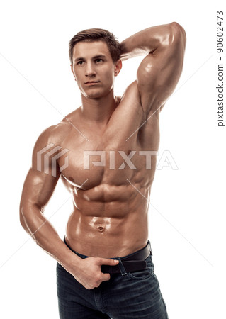 Muscular handsome young man with naked torso. Isolated on white background. 90602473