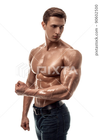 Muscular handsome young man with naked torso. Isolated on white background. Muscular handsome young man with naked torso. Isolated on white background. 90602500