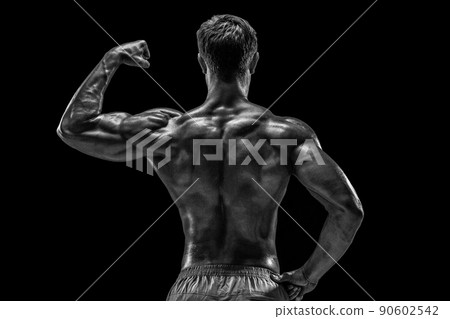 Strong Athletic Man Fitness Model posing back muscles, triceps o Strong Athletic Man Fitness Model posing back muscles, triceps o 90602542