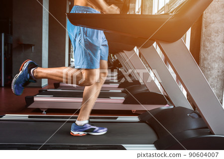 Legs running on the treadmill close up Legs running on the treadmill close up 90604007