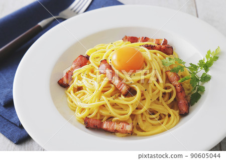A delicious carbonara with egg yolk on it 90605044
