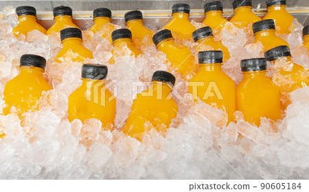 food and drink, orange juice in a bottle with ice food and drink, orange juice in a bottle with ice 90605184