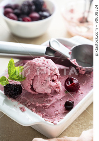 Pink ice cream scoop close up. Homemade pink healthy sorbet with banana and berry, ice cream refresing treat Pink ice cream scoop close up. Homemade pink healthy sorbet with banana and berry, ice cream refresing treat 90608524