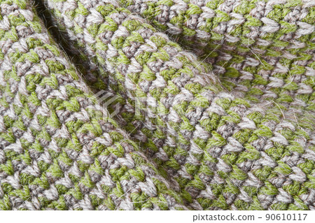 Gray green knitting wool texture background. Canvas is crocheted of natural threads in natural colors 90610117
