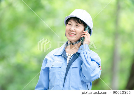 Female manager in work clothes, smartphone Female manager in work clothes, smartphone 90610595