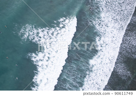 Amazing aerial view Top down of waves break on tropical sea Surfers with surfing boards Aerial drone view of sea waves on the beautiful ocean at Phuket Thailand Amazing aerial view Top down of waves break on tropical sea Surfers with surfing boards Aerial drone view of sea waves on the beautiful ocean at Phuket Thailand 90611749