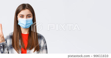 Coronavirus outbreak, leisure on quarantine, social distancing and emotions concept. Close-up of cheerful attractive woman in medical mask show number three, third, white background Coronavirus outbreak, leisure on quarantine, social distancing and emotions concept. Close-up of cheerful attractive woman in medical mask show number three, third, white background 90611810