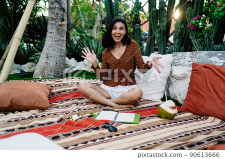 Happy ethnic woman having fun in tropical park Happy ethnic woman having fun in tropical park 90613666
