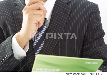 Office worker man with a passbook Office worker man with a passbook 90614173