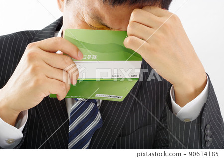 Office worker man with a passbook 90614185