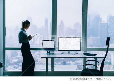 Businesswoman with gadgets in office lounge 90614499