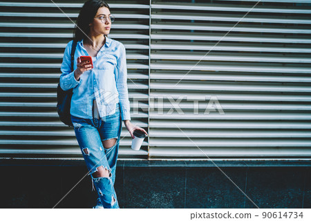 Pondering female blogger thoughtful looking away using mobile phone and 4G internet Pondering female blogger thoughtful looking away using mobile phone and 4G internet 90614734