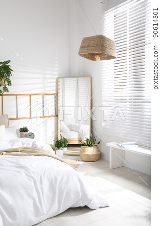 Modern bedroom interior with stylish large mirror 90614801